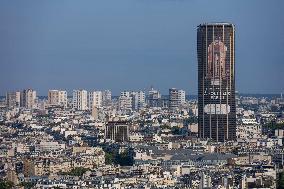 Paris 2024 - Giant Image Of Superstar Leon Marchand Diplayed On The Tour Montparnasse