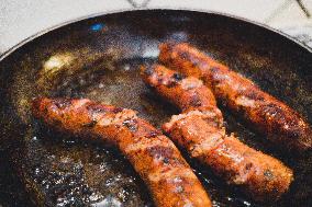 Cooking Scrambled Eggs With Sausages In Chania