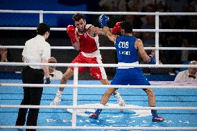 Paris 2024 - Cuba's Alvarez Beats France’s Oumiha In The Men's 63.5kg Final