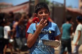 Palestinians Receive Food Rations Amid Conflict