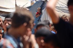 Palestinians Receive Food Rations Amid Conflict