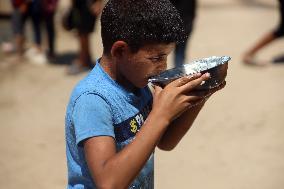 Palestinians Receive Food Rations Amid Conflict