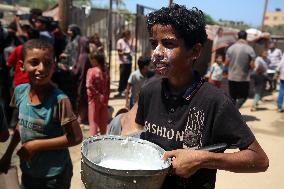 Palestinians Receive Food Rations Amid Conflict