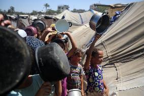 Palestinians Receive Food Rations Amid Conflict