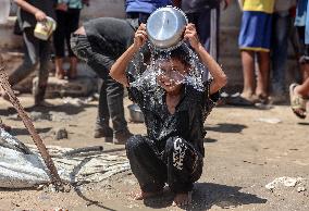 Palestinians Receive Food Rations Amid Conflict