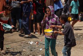 Palestinians Receive Food Rations Amid Conflict