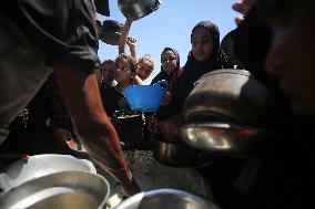 Palestinians Receive Food Rations Amid Conflict