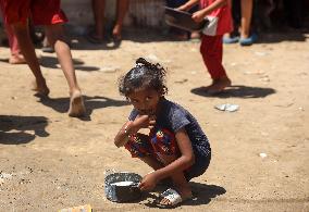 Palestinians Receive Food Rations Amid Conflict