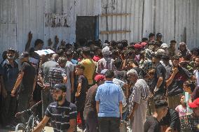 People Receive Food Aid In Jabalia Camp - Gaza