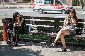 People using smartphones in Kyiv streets