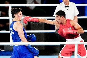 Paris 2024 - Boxing 71kg - Asadkhuja Muydinkhujaev Wins Gold