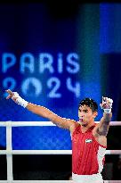 Paris 2024 - Boxing 71kg - Asadkhuja Muydinkhujaev Wins Gold