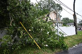 Severe Weather Causes Tree To Damage Home And A Fence With Power Lines Destroyed In Hillsdale New Jersey