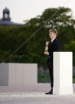 Paris 2024 - Leon Marchand Carries Olympic Flame At Closing Ceremony