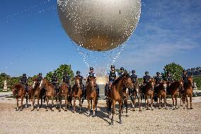 Paris 2024 - Mounted Policemen Pose Next To The Olympic Cauldron