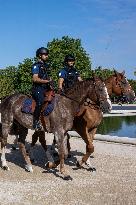 Paris 2024 - Mounted Policemen Pose Next To The Olympic Cauldron