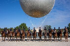 Paris 2024 - Mounted Policemen Pose Next To The Olympic Cauldron