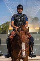 Paris 2024 - Mounted Policemen Pose Next To The Olympic Cauldron