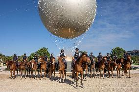 Paris 2024 - Mounted Policemen Pose Next To The Olympic Cauldron