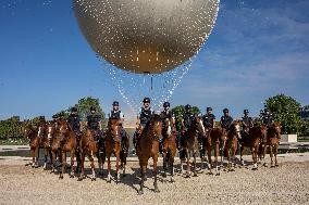 Paris 2024 - Mounted Policemen Pose Next To The Olympic Cauldron