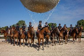 Paris 2024 - Mounted Policemen Pose Next To The Olympic Cauldron