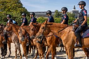 Paris 2024 - Mounted Policemen Pose Next To The Olympic Cauldron