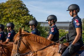 Paris 2024 - Mounted Policemen Pose Next To The Olympic Cauldron