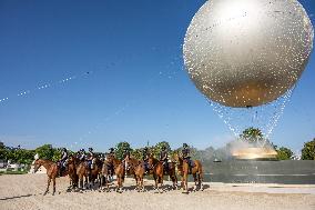 Paris 2024 - Mounted Policemen Pose Next To The Olympic Cauldron