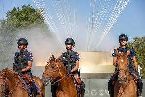 Paris 2024 - Mounted Policemen Pose Next To The Olympic Cauldron