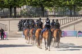 Paris 2024 - Mounted Policemen Pose Next To The Olympic Cauldron