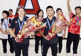 Japanese athletes return home from Paris