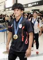 Japan athletes return home from Paris