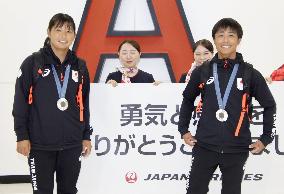 Japan athletes return home from Paris