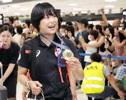 Japan athletes return home from Paris