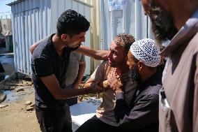 A Palestinian Mourns During Funeral of His Children - Deir al-Balah