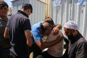 A Palestinian Mourns During Funeral of His Children - Deir al-Balah