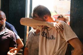 A Palestinian Mourns During Funeral of His Children - Deir al-Balah