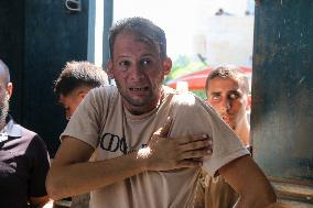 A Palestinian Mourns During Funeral of His Children - Deir al-Balah