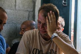 A Palestinian Mourns During Funeral of His Children - Deir al-Balah