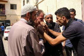 A Palestinian Mourns During Funeral of His Children - Deir al-Balah