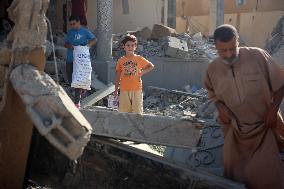 Gazans Search Through Rubble Following Strike