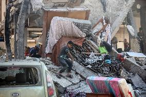 Gazans Search Through Rubble Following Strike