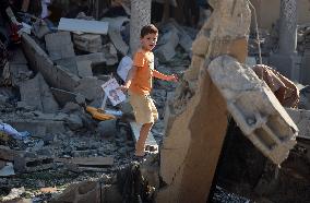 Gazans Search Through Rubble Following Strike