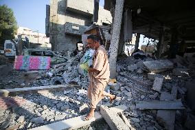 Gazans Search Through Rubble Following Strike