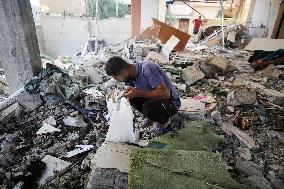 Gazans Search Through Rubble Following Strike