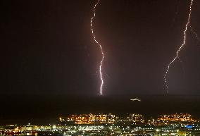 Lightning falls in front of the port of Barcelona