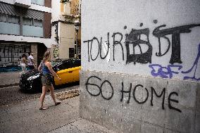 Graffiti And Messages Against Tourism In Barcelona.