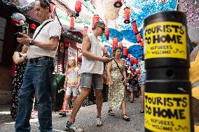 Graffiti And Messages Against Tourism In Barcelona.