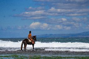 Horse Riders Perform At The Komune Beach In Bali