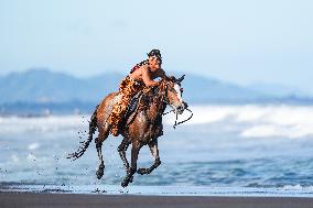 Horse Riders Perform At The Komune Beach In Bali